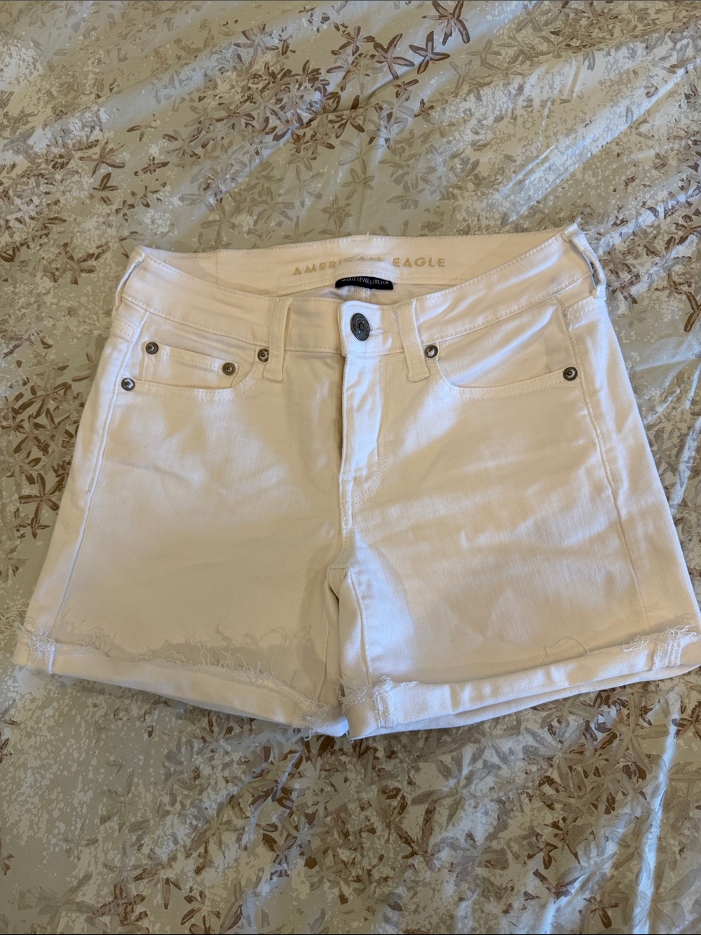American Eagle Outfitters Cream-White Denim Shorts with Raw Hem